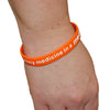 medpac wristband on a wrist with "I carry emergency medicine in a medpac" print